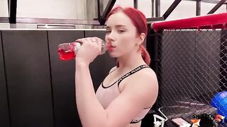 A trainer is having his way with a fiery redhead at the gym