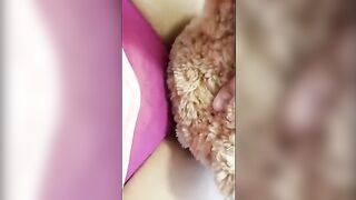 A girl is having fun with her new teddy bear in a steamy session