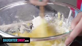 The girls are backing a pie for their stepdads, showcasing their skills