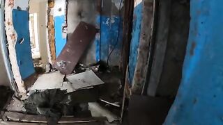 An exhibitionist girl is walking around horrible buildings with her hot babe