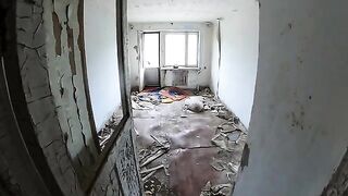 An exhibitionist girl is walking around horrible buildings with her hot babe