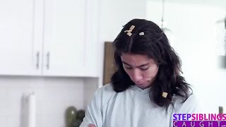 The guy is fucking with the sexy stepsister in the kitchen