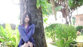 A hot girl masturbates with a dildo in the garden and squirts