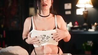 A goth girl with big boobs has fun with a new toy, showcasing her playful side