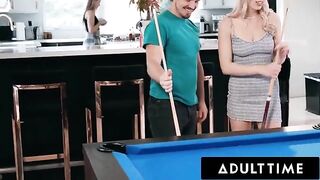 Roommates Paige Owens and Kay Lovely use a stud for a game