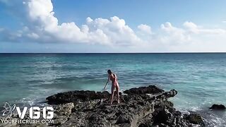 A hot girl is fucking on the beach without any clothes on