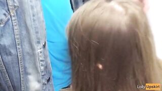 Public blowjob in the changing room of a shop, risking to be caught