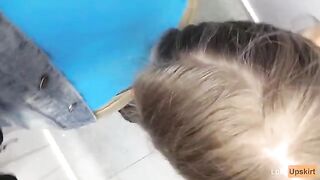 Public blowjob in the changing room of a shop, risking to be caught