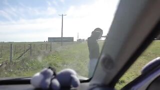 A girl is sucking a cock of her boyfriend in the car on a road trip