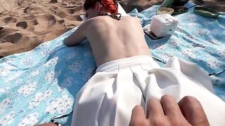 A couple engaged in intimate kebab sales on the public beach, showcasing raw passion