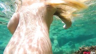 Babe has sex with a guy right in the water, showcasing her wild side