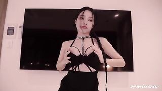 An Asian girl in a black dress had an intense encounter, finishing with a powerful release