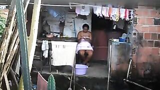A hidden camera has captured a black woman in a private moment