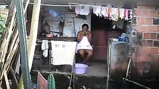 A hidden camera has captured a black woman in a private moment