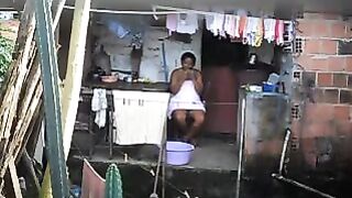 A hidden camera has captured a black woman in a private moment