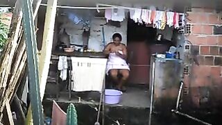 A hidden camera has captured a black woman in a private moment