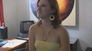 A sexy brunette with big natural tits is completely naked in the bedroom