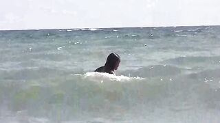 Two girls sunbathe naked on the beautiful beach