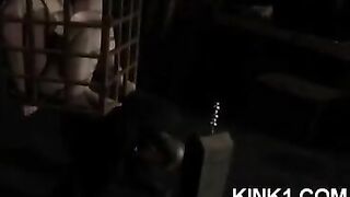 The slave is in the cage and fulfills all the orders of his master
