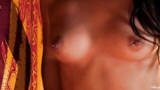 A chick with pierced nipples playing with her fingers in her pussy