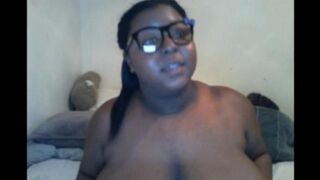 The black woman closed the camera with her big natural milk