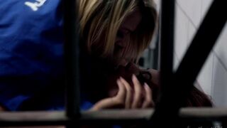 Two girls are having fun by licking each other in their cell