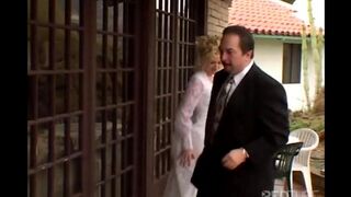 The girl makes a deep blowjob while her husband is in the same room