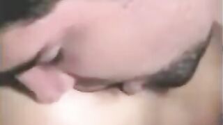 The guy is having his way with a sex toy, while another plays with his cock