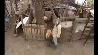 A Russian girl has sex with a guy in the village outdoors