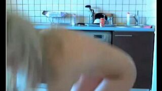 The guy masturbates a naive girl in the kitchen