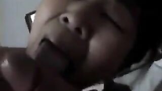 A Chinese woman practices her blowjob skills on her man in a steamy homemade scene