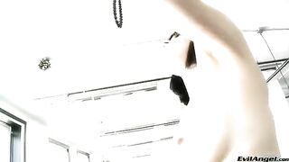 The cute woman wears sexy high heels and plays with the balls