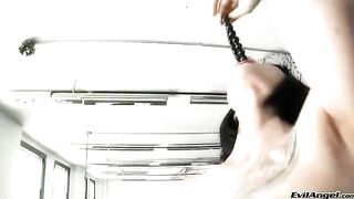 The cute woman wears sexy high heels and plays with the balls