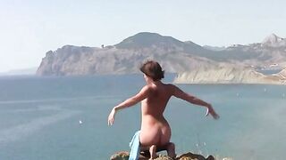 A beautiful body of a naked girl on the beach is very hot