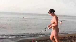 Nude beauty playing on the beach in HD quality
