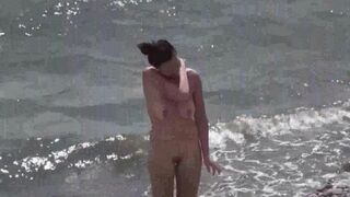 A couple of free love on the beach without any clothes