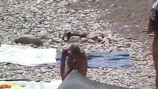 A couple of free love on the beach without any clothes