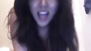 The hot Asian girl enjoys solo masturbation on her bed