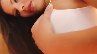 The girl plays with a dildo to demonstrate her vagina
