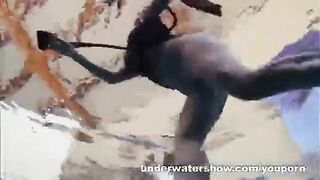 A girl is fucking in the pool without any clothes on her body