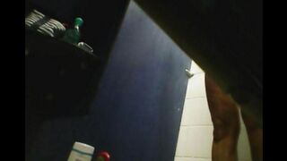 In the shower, a hidden camera captures a girl’s shaved pussy, surprising her
