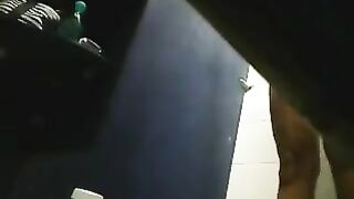 In the shower, a hidden camera captures a girl’s shaved pussy, surprising her