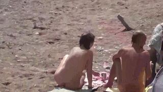 A group of naked beauties are having fun in the sea water