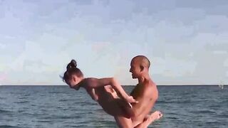 Acrobats are more comfortable without clothes on the beach