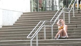 A girl walks on the street without panties, it is very dangerous