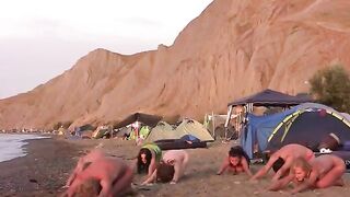 A sexy game of volleyball with naked beauties on the beach