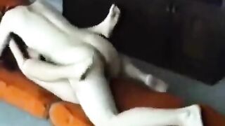 A married couple has sex at their home, showcasing a passionate and intimate encounter