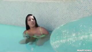 The girl received swimming lessons from a man in the pool