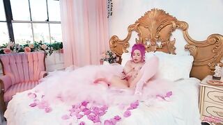 A woman with big boobs fucks herself with toys