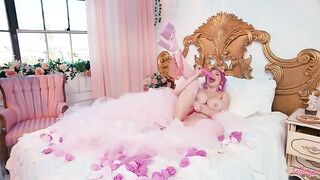 A woman with big boobs fucks herself with toys
